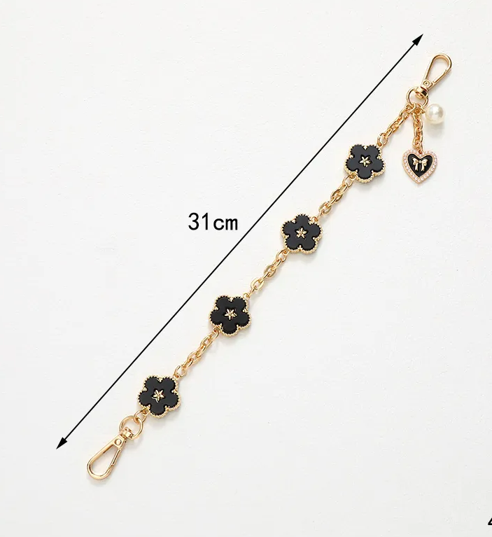Elegant Five Leaf Flower Keychain – Gold Floral Bag Charm with Faux Pearl Heart Accent