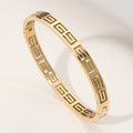 Stainless Steel Geometric Cutout Hinged Bangle Bracelet: Yellow Gold